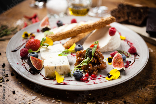 Cheese platter for two served on a plate in restaurant