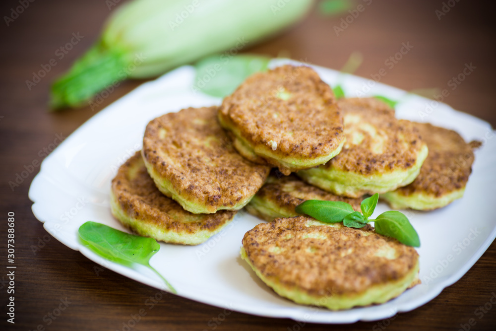 vegetable fritters made from green zucchini in a plate vegetable fritters made from green zucchini in a plate