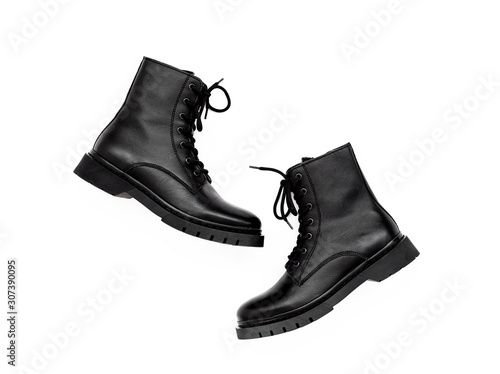Women's fashion leather shoes for autumn, spring, European winter. Boots for a modern grunge woman. Women's black boots with laces isolated on white. Autumn. Fashion. Style.