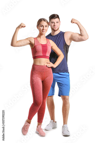 Sporty young couple on whit...