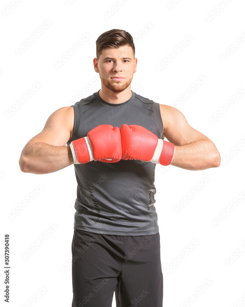 Sporty young boxer on white background