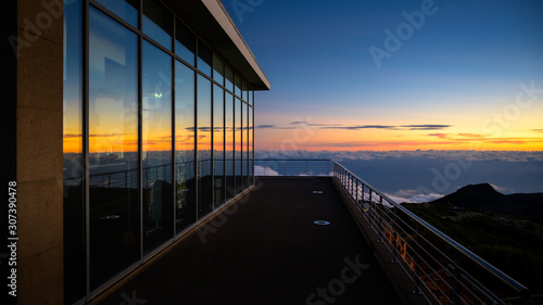 glass building on the top of the mountain at sunset © Krzysztof