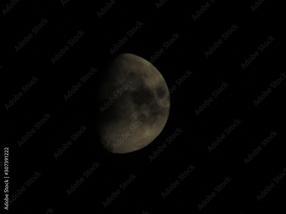 Half Moon Background The Moon is an astronomical body that orbits planet Earth, being Earth's only permanent natural satellite Half Moon Background The Moon is an astronomical body that orbits planet Earth, being Earth's only permanent natural satellite