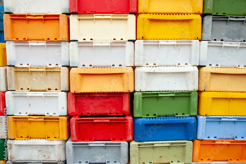 Colorful plastic fish crates in harbor