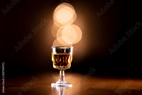 Glass of Bourbon Whiskey on a Wooden Table