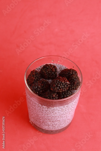 glass of chia pudding with blackberry flavor