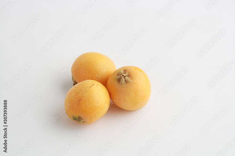 delicious yellow medlar fruit with white background delicious yellow medlar fruit with white background