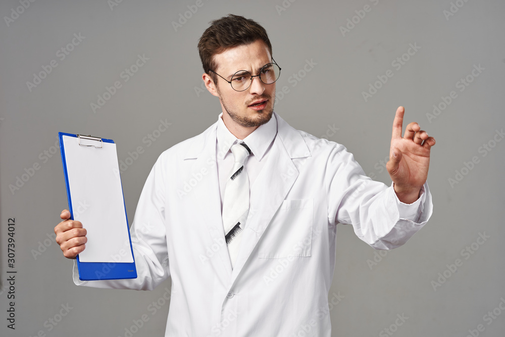 portrait of a doctor with clipboard portrait of a doctor with clipboard