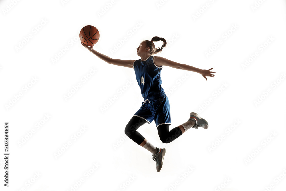 Young caucasian female basketball player of team in action, motion in jump isolated on white background. Concept of sport, movement, energy and dynamic, healthy lifestyle. Training, practicing. Young caucasian female basketball player of team in action, motion in jump isolated on white background. Concept of sport, movement, energy and dynamic, healthy lifestyle. Training, practicing.