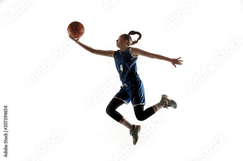 Young caucasian female basketball player of team in action, motion in jump isolated on white background. Concept of sport, movement, energy and dynamic, healthy lifestyle. Training, practicing. © master1305