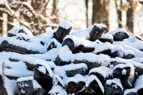 Pile of firewood under the snow