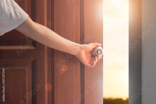 Women hand open door knob or opening the door,grand opening,Close up hand open door.