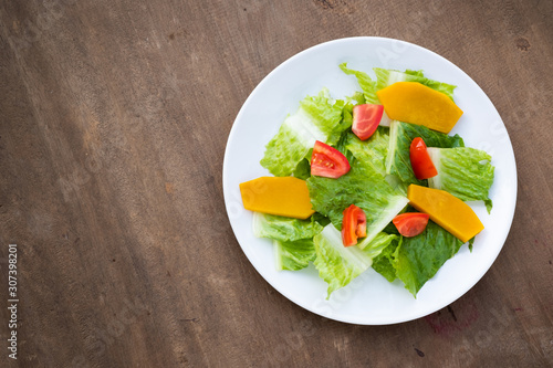 Mix salad vegetable  in white dish,vegan copy space