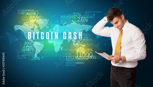 Businessman in front of a decision with BITCOIN CASH inscription, business concept