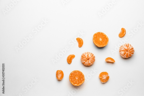 Sweet tangerines on white background photo