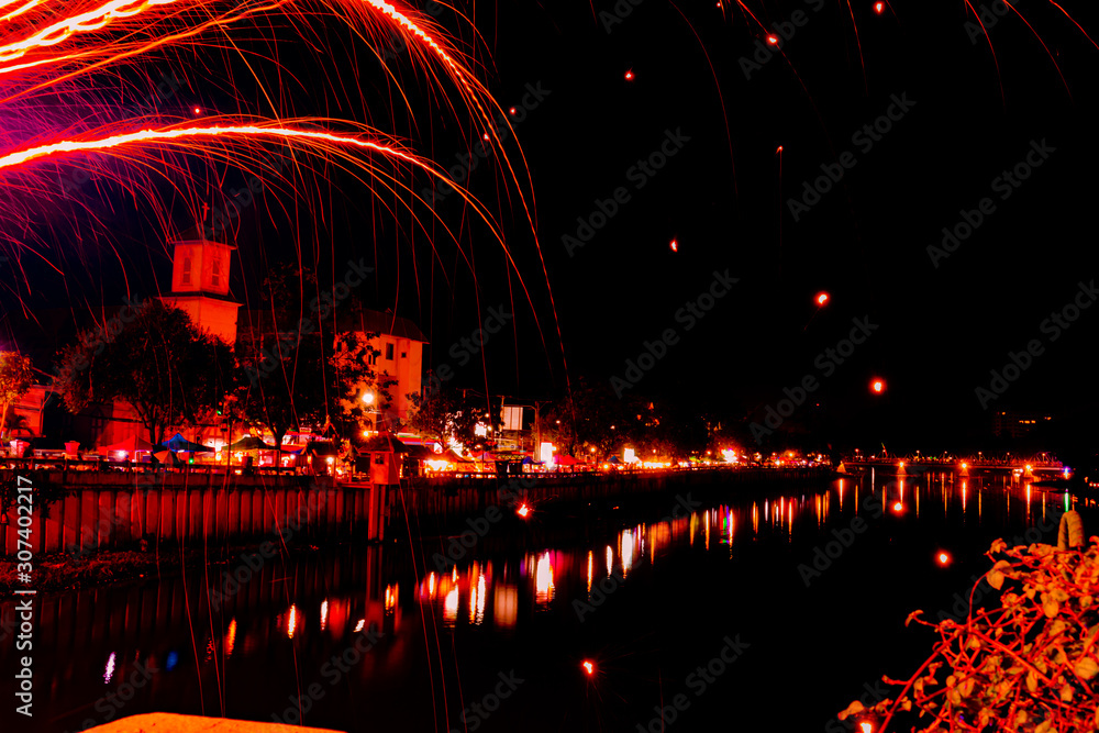 firework, lights and landscape during loy krathong festival in Thailand