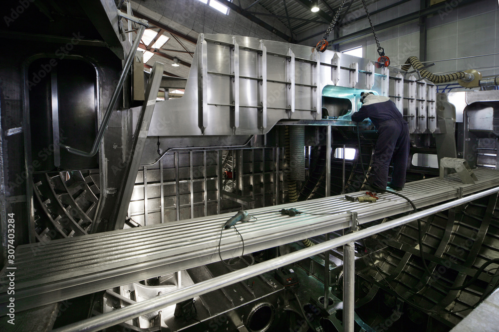 At the ship yard. Shipbuilding. Sailingyacht hull. Welding. Aluminium At the ship yard. Shipbuilding. Sailingyacht hull. Welding. Aluminium