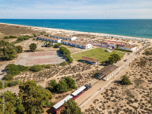 Famous Barril Beach next to Tavira, Algarve, Portugal photo