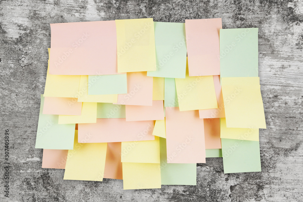 Fototapeta premium A lot of note papers on old wall