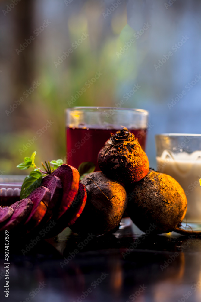 Beetroot face mask on a black glossy surface consisting of some beetroot  juice well mixed with