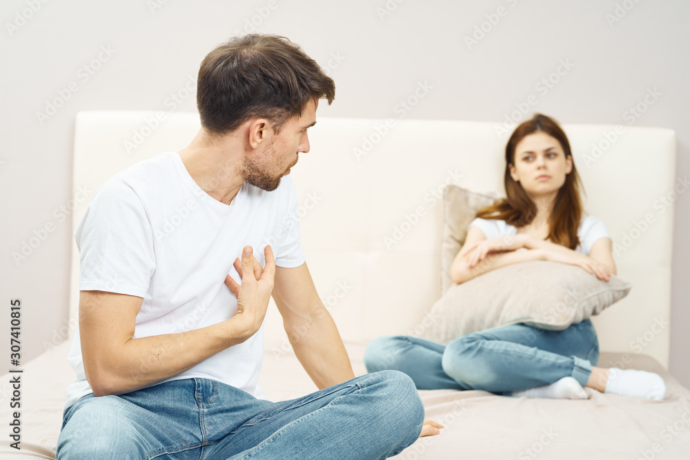 young couple sitting on sofa at home young couple sitting on sofa at home