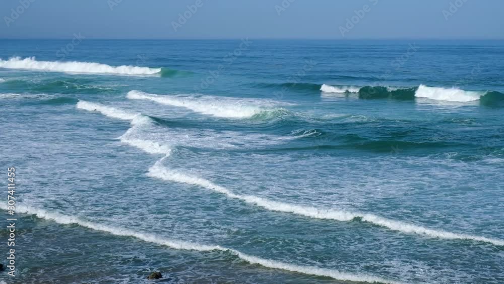 Tropical beach aerial view, Top view of waves break on tropical white sand beach. Sea waves seamless loop on the beautiful sand beach. Tropical beach aerial view, Top view of waves break on tropical white sand beach. Sea waves seamless loop on the beautiful sand beach.