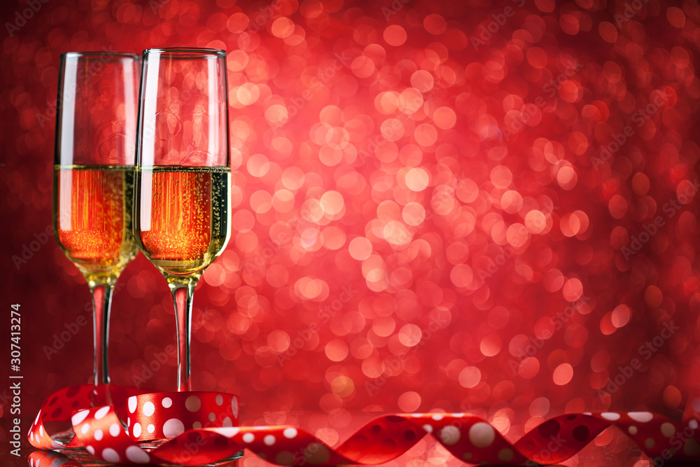 Champagne glasses on a beautiful bokeh background. Valentine's day. Background with copy space. Selective focus. Horizontal. Champagne glasses on a beautiful bokeh background. Valentine's day. Background with copy space. Selective focus. Horizontal.