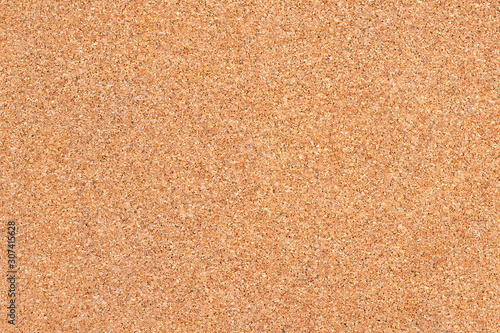 Brown cork board surface for background.