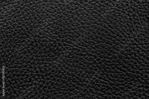 Natural black luxury of cow skin leather texture surface for background. 