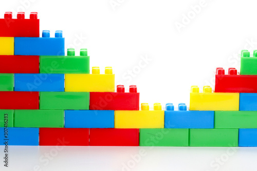 Plastic toy block over white background