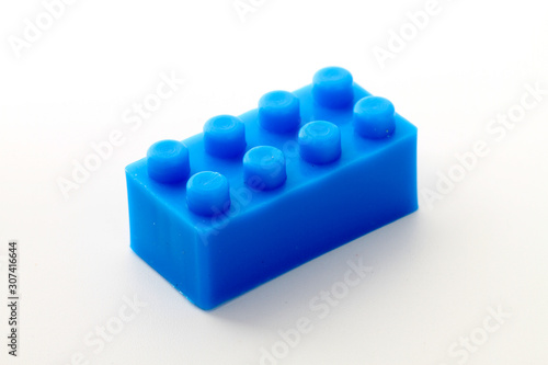 Plastic toy block over white background
