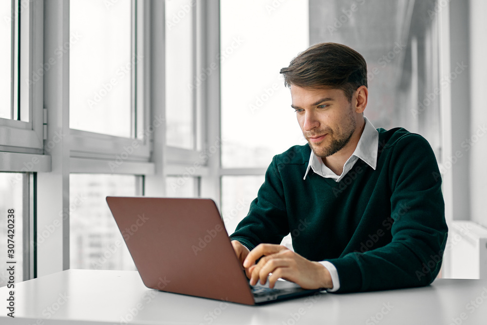 young man working on laptop at home young man working on laptop at home