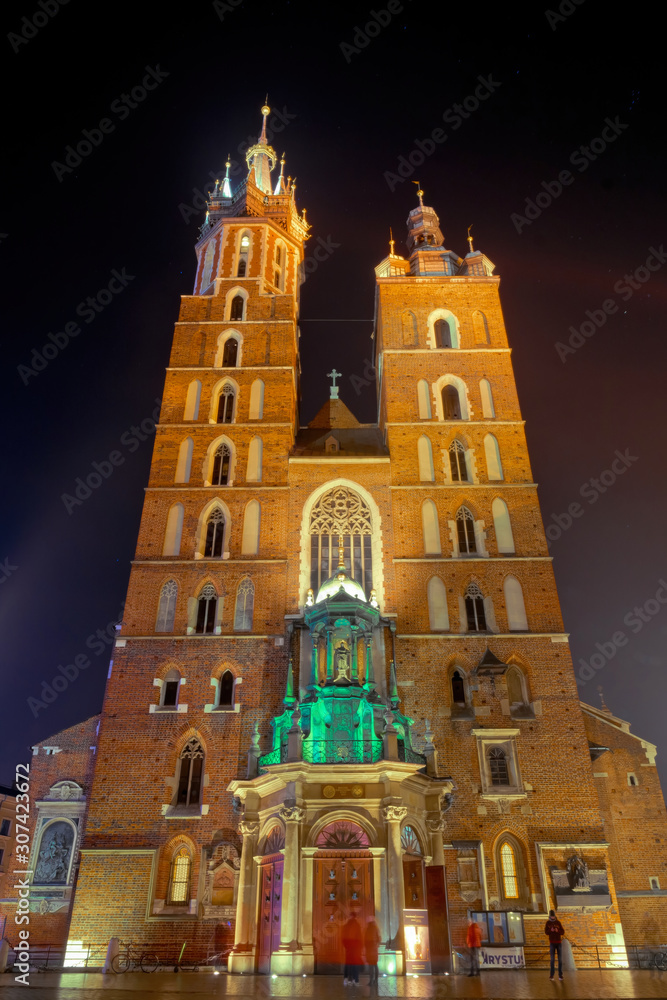 Facade and belfries of the old Catholic Mariack Cathedral in Krakow, Poland
