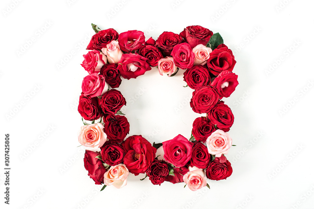 Square frame border of pink, red rose flowers on white background. Mockup blank copy space. Flat lay, top view floral composition. Square frame border of pink, red rose flowers on white background. Mockup blank copy space. Flat lay, top view floral composition.