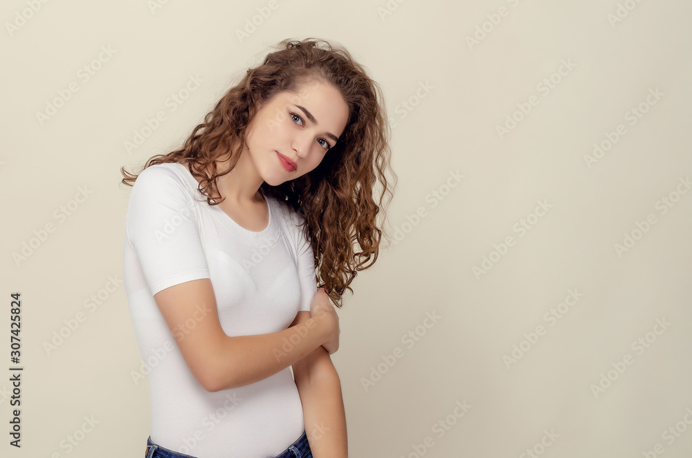 Portrait of waist-high girl with brown curly hair in white Portrait of waist-high girl with brown curly hair in white