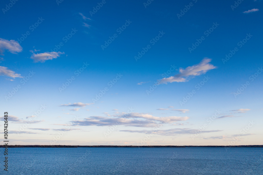 Beautiful sunset sky over calm lake