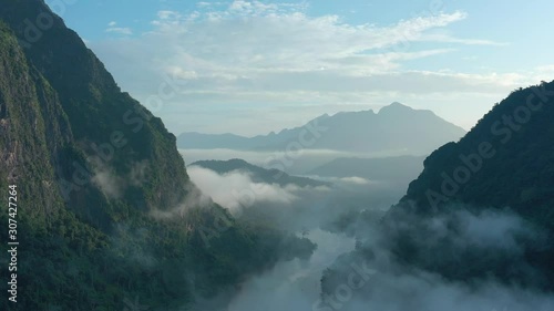 Aerial view of mountains and river Nong Khiaw. North Laos. Southeast Asia. Photo made by drone from above. Bird eye view.