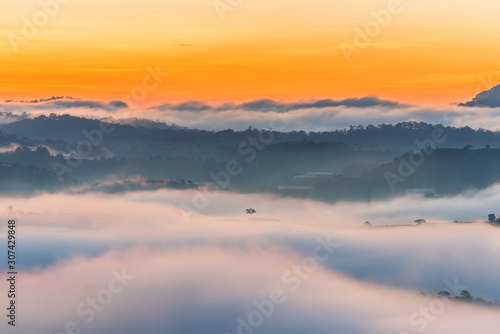Wallpaper Mural Beautiful foggy and cloudy mountain range landscape at sunrise morning Torontodigital.ca
