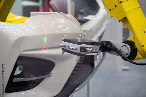 Photos Automated robotic arm CMM scanning in automotive insustry