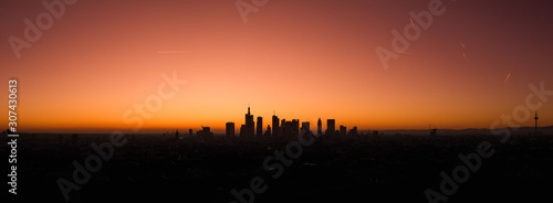 Aerial view with the silhouette drone in Frankfurt am Main at sunset in winter.