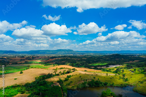 Aerial view landscape in Nakhon Ratchasima province, Thailand. Scenery consist of mountain and blue sky with clouds. © Panwasin