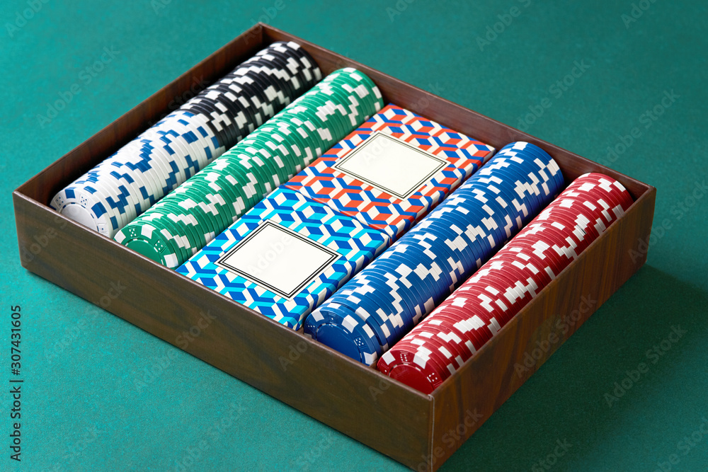 Poker set case on green texture background. Poker cards and chips Poker set case on green texture background. Poker cards and chips