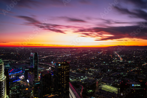 Dusk settles in over the city of Los Angeles, with streaking skies and hazy background