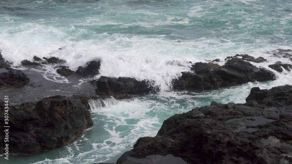 Salty Brine and Ocean Water Spilling onto a Rocky Shore Salty Brine and Ocean Water Spilling onto a Rocky Shore