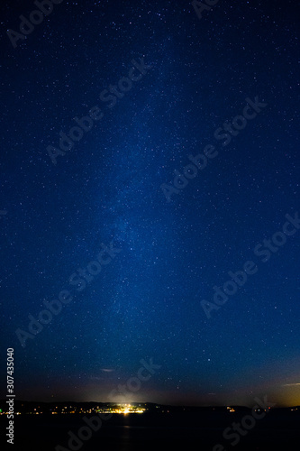 The Milky Way stretches over Puget Sound at night