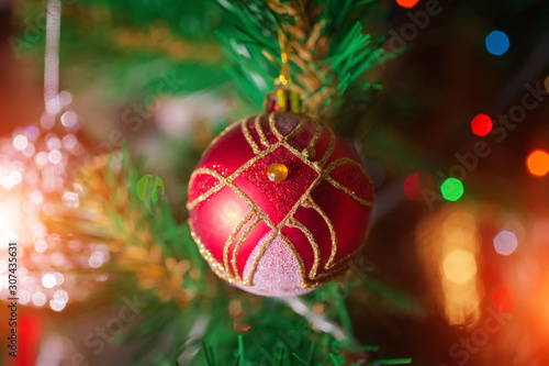 Red Christmas ball on a Christmas tree
