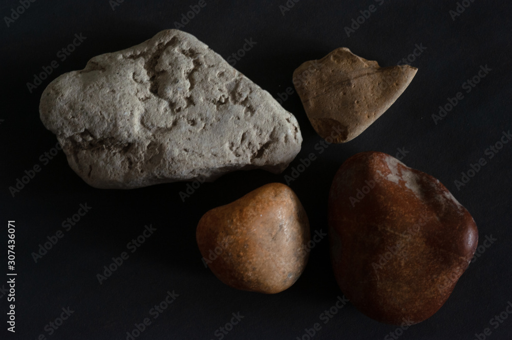 stones on black background stones on black background