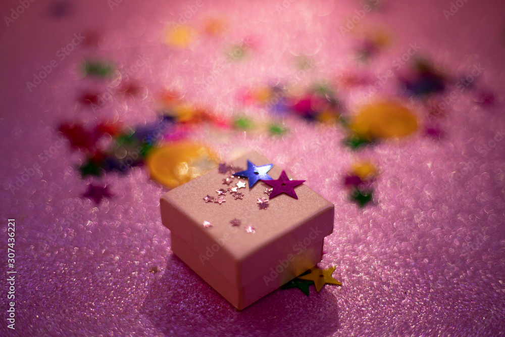 pink gift box with glittery background pink gift box with glittery background
