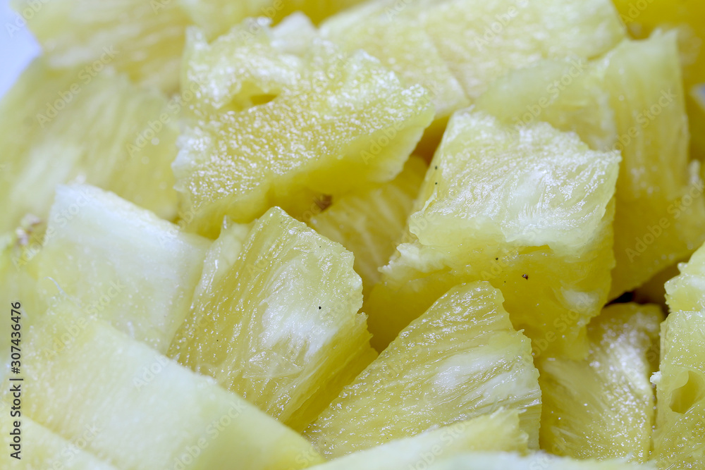 Close up slice pineapple background texture in white dish. Slide and piece of fresh fruit. Close up slice pineapple background texture in white dish. Slide and piece of fresh fruit.