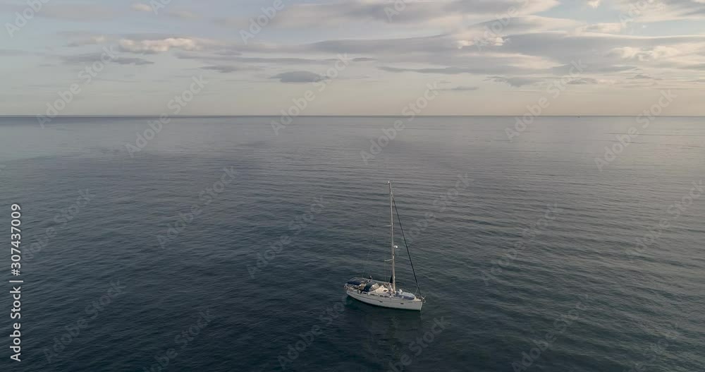 Aerial video with sailboat drone in the Mediterranean with dropped candles at sunset_Spain Aerial video with sailboat drone in the Mediterranean with dropped candles at sunset_Spain